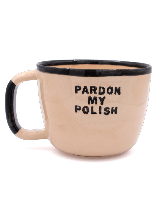 Ceramiczny kubek z uchem i napisem "pardon my polish"